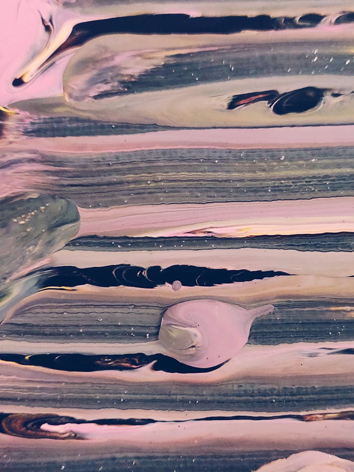 Abstract painting featuring textured streaks in pink and gray, offering a modern artistic design.